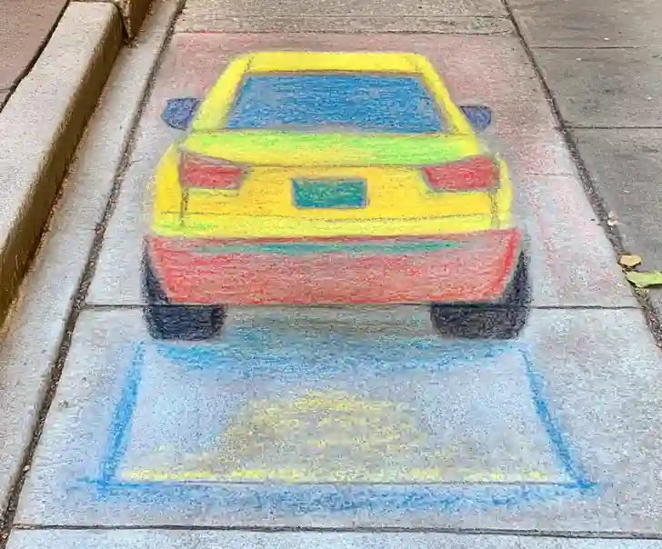 Simple chalk drawing of a yellow car