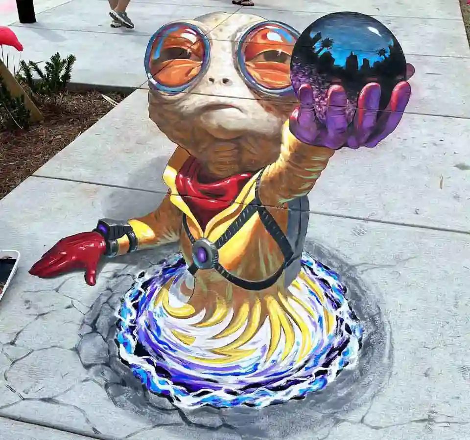 Alien Offering 3D chalk art, a 10ft x 20ft anamorphic street painting by Chris Carlson in Panama City, Florida