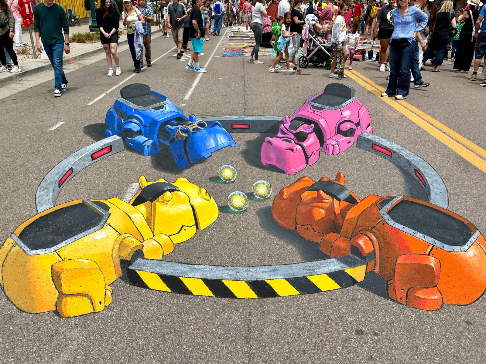 Hungry Hungry Hippos robot 3D chalk art, a 15ft x 25ft interactive street painting by Chris Carlson at the 2025 Denver Chalk Art Festival