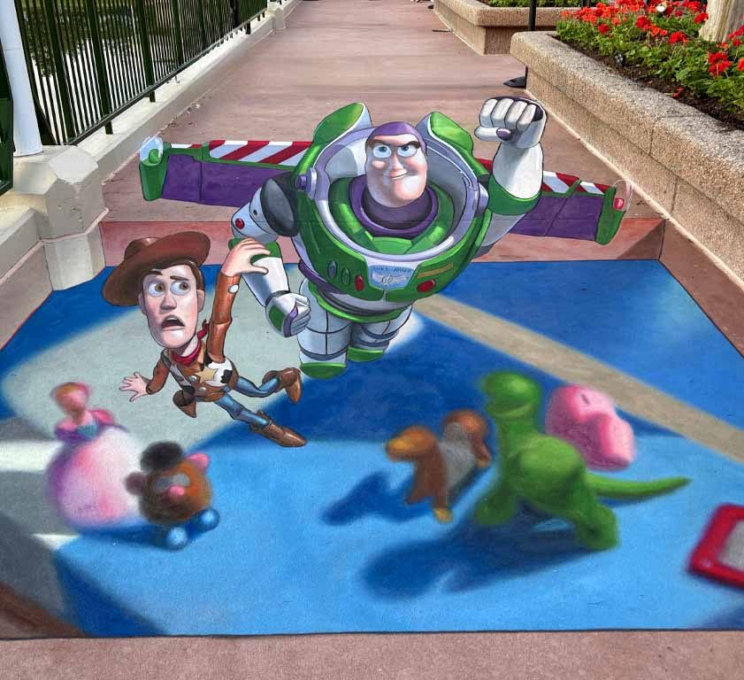 Toy Story 3D chalk art illusion, a 10ft x 22ft street painting by Chris Carlson at Epcot, Walt Disney World in Orlando, Florida